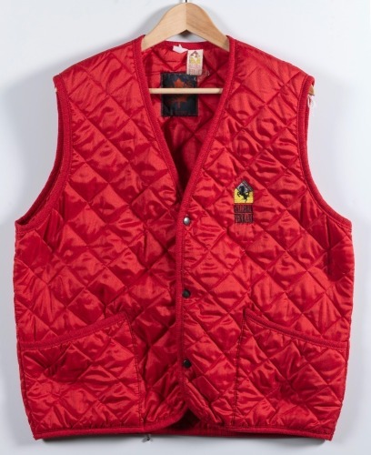 FERRARI: A red coloured padded vest with 'Galleria Ferrari' emblem to left side, made by Canadians (Italy), two pockets, size unknown (appears large) [Location: Melbourne]