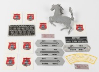 FERRARI: A group of assorted tags & stickers associated with Ferrari, together with a reproduction 'Cavallino Rampante' badge [Location: Melbourne]
