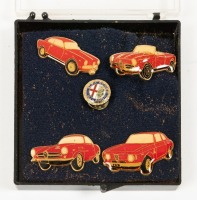 ALFA ROMEO: A set of small Alfa Romeo badges, includes four early Alfa model badges and one emblem badge [Location: Melbourne]