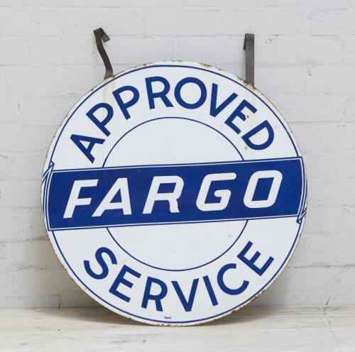 FARGO: An enamel 'Approved Fargo Service' circular sign.