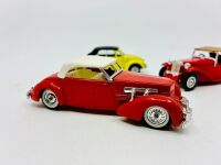 MATCHBOX: Two Matchbox Models of Yesteryear 1:43 scale models including a 1945 MG TC and a 1937 Cord 812 as well as a 1:43 scale VW Beetle Cabriolet by Polistil, all in original packaging [Location: Sydney] - 2
