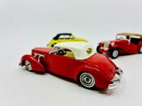 MATCHBOX: Two Matchbox Models of Yesteryear 1:43 scale models including a 1945 MG TC and a 1937 Cord 812 as well as a 1:43 scale VW Beetle Cabriolet by Polistil, all in original packaging [Location: Sydney] - 3