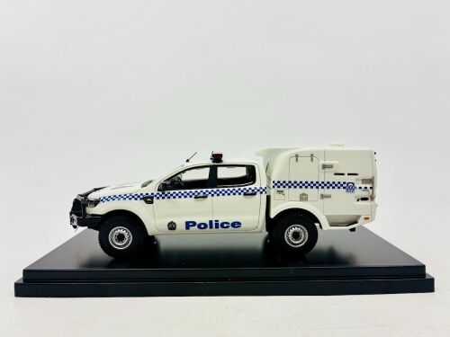 129 · FORD: A 1:43 scale model by Trax of the Ford Ranger Paddy Wagon with display case [Location: Sydney]