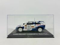 FORD: A 1:43 scale model by IXO of the #7 Ford Escort Cosworth, driven by T.Makinen in the 1994 1000 Lakes Rally [Location: Sydney] - 5