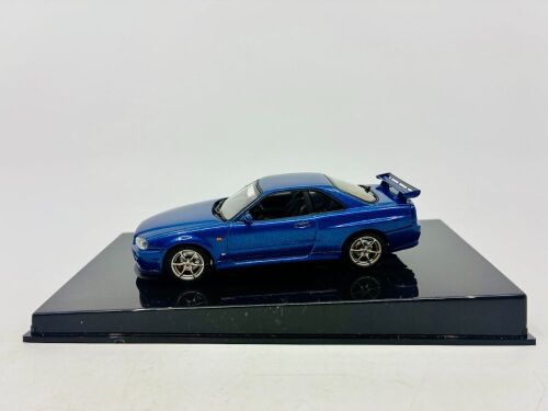 324 · NISSAN: A 1:43 scale model by Autoart of the Nissan Skyline R34 GTR , complete with original packaging [Location: Sydney]
