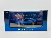 NISSAN: A 1:43 scale model by Autoart of the Nissan Skyline R34 GTR , complete with original packaging [Location: Sydney] - 7