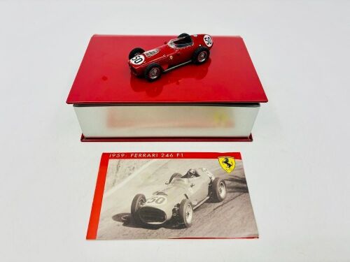 385 · FERRARI: A 1:43 scale model by Hot Wheels of the 1959 Ferrari 246 F1, complete with original packaging [Location: Sydney]