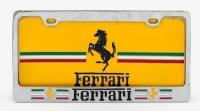 NUMBER PLATE: A modern Ferrari number plate frame with Ferrari display plate, 16cm high, 31.5cm wide [Location: Melbourne]