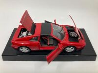 FERRARI: A group of three models including a 348 ts by Maisto, Testarossa and F40 by Burago - 4