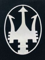MASERATI: An oval chrome Trident emblem, approx 14.5cm high x 10cm wide