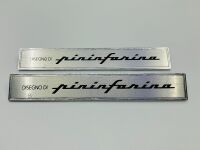 PININFARINA: A pair of badges 'Disegno di Pininfarina' with mounts, approx. 14.5cm wide x 2.3cm high - 2