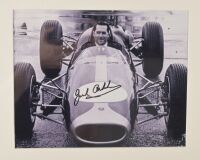 WORKSHOP:Two B/W photos featuring Jack & Ron working on a car together with another with Jack in the car, each signed by Jack and lower image also signed by Ron - 2