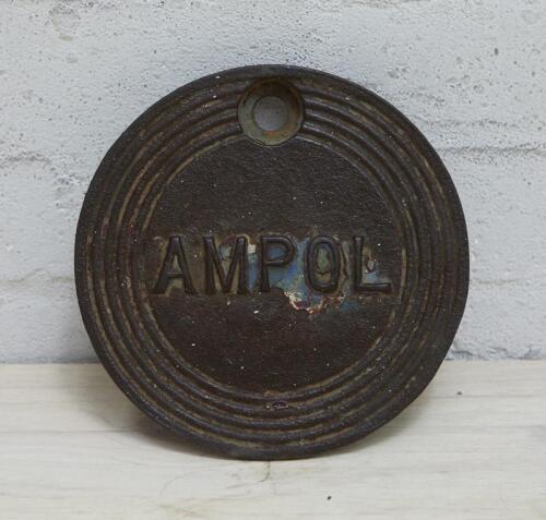 AMPOL: A cast iron service station underground tank filler cover plate with Ampol lettering, 20cm diameter.