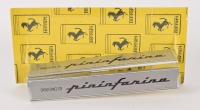 PININFARINA: A pair of c1980s Ferrari 'Pininfarina' body badges, 14.5cm long each. NOS [Location: Melbourne]