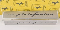 PININFARINA: A pair of c1980s Ferrari 'Pininfarina' body badges, 14.5cm long each. NOS [Location: Melbourne] - 2