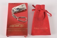 TESTAROSSA: A 1984 Ferrari Testarossa keyring in a velvet pouch, within a presentation box made by Bburago [Location: Melbourne]