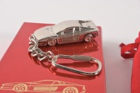TESTAROSSA: A 1984 Ferrari Testarossa keyring in a velvet pouch, within a presentation box made by Bburago [Location: Melbourne] - 2