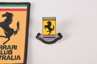 FERRARI OWNERS CLUB: Three items related to the Ferrari Owners Club Australia, including a patch, badge, and multiple adhesion 2001 window sticker [Location: Melbourne] - 2
