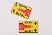 EMERGENCY KEYS: Two c1980s Ferrari emergency wallet keys, one being cut, one uncut [Location: Melbourne]