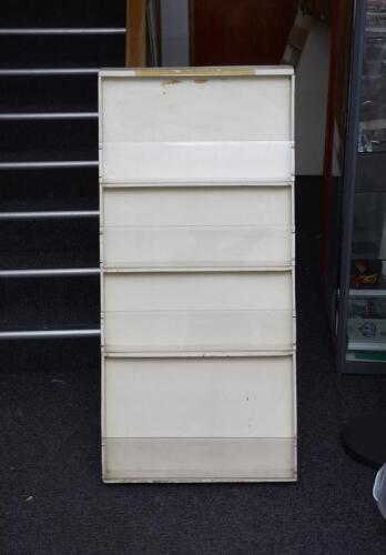 A timber/perspex service station road map display stand with integral storage at rear.