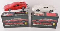TESTAROSSA: Two 1980s 'Ferrari Formula' Testarossa Telephones, one in white, the other red. Boxed [Location: Melbourne]