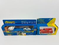 MATCHBOX: A Matchbox 1:43 scale models including the 'Mitre Ten Racing Team' truck and race car together with a Trax Holden Fj Van in Coca-Cola livery, all in original packaging. [Location: Sydney]
