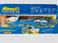 MATCHBOX: A Matchbox 1:43 scale models including the 'Mitre Ten Racing Team' truck and race car together with a Trax Holden Fj Van in Coca-Cola livery, all in original packaging. [Location: Sydney] - 2