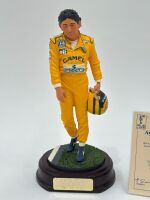 SENNA: A 1:9 scale limited edition (3945/5000) cold cast porcelain resin figure of Ayrton Senna sculpted by Paul Szeiler for Endurance Ltd, on a wooden base with engraved plaque, NIB and accompanied by a COA from The Art of Sport, 23cm high - 2