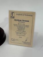SENNA: A 1:9 scale limited edition (3945/5000) cold cast porcelain resin figure of Ayrton Senna sculpted by Paul Szeiler for Endurance Ltd, on a wooden base with engraved plaque, NIB and accompanied by a COA from The Art of Sport, 23cm high - 5