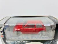 MINI COOPER: A 1:24 scale model kit by Welly of the Mini Cooper, complete with original packaging [Location: Sydney] - 2