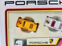 PORSCHE: A Matchbox Porsche Gift Set (MC-23) featuring a transporter and four 1:64 scale Porsche models, complete with original packaging [Location: Sydney] - 2