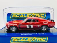 ALLAN MOFFAT: A pair of models of Moffat's No. 9 Mustang including a limited edition Scalextric slot car, numbered 2940/3500 together with a 1:64 scale model by DDA Collectibles and two unframed photographs (one signed by Allan Moffat) [Location: Sydney] - 6