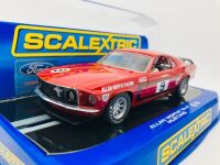 ALLAN MOFFAT: A pair of models of Moffat's No. 9 Mustang including a limited edition Scalextric slot car, numbered 2940/3500 together with a 1:64 scale model by DDA Collectibles and two unframed photographs (one signed by Allan Moffat) [Location: Sydney] - 7