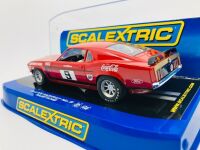 ALLAN MOFFAT: A pair of models of Moffat's No. 9 Mustang including a limited edition Scalextric slot car, numbered 2940/3500 together with a 1:64 scale model by DDA Collectibles and two unframed photographs (one signed by Allan Moffat) [Location: Sydney] - 8