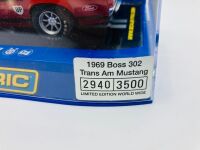 ALLAN MOFFAT: A pair of models of Moffat's No. 9 Mustang including a limited edition Scalextric slot car, numbered 2940/3500 together with a 1:64 scale model by DDA Collectibles and two unframed photographs (one signed by Allan Moffat) [Location: Sydney] - 9