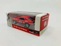 ALLAN MOFFAT: A pair of models of Moffat's No. 9 Mustang including a limited edition Scalextric slot car, numbered 2940/3500 together with a 1:64 scale model by DDA Collectibles and two unframed photographs (one signed by Allan Moffat) [Location: Sydney] - 12