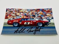 ALLAN MOFFAT: A pair of models of Moffat's No. 9 Mustang including a limited edition Scalextric slot car, numbered 2940/3500 together with a 1:64 scale model by DDA Collectibles and two unframed photographs (one signed by Allan Moffat) [Location: Sydney] - 13