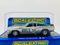 ALLAN MOFFAT: A 1:32 Scalextric slot car of Allan Moffat's No. 33 Brut sponsored Ford Mustang, in original packaging together with a copy of his hardcover autobiography 'Allan Moffat: Climbing the Mountain' [Location: Sydney]