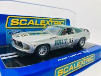 ALLAN MOFFAT: A 1:32 Scalextric slot car of Allan Moffat's No. 33 Brut sponsored Ford Mustang, in original packaging together with a copy of his hardcover autobiography 'Allan Moffat: Climbing the Mountain' [Location: Sydney] - 2