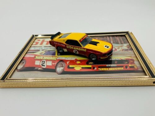 29 · FORD MUSTANG SPORTS SEDAN: A 1:43 scale model by Armco of Jim Richards' Sidchrome Mustang Sports Sedan, together with a framed colour photo of the same car [Location: Sydney]