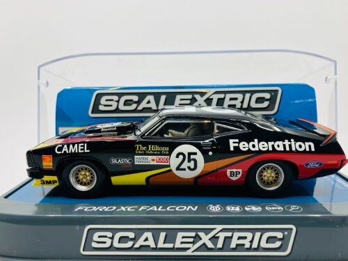 49 · FORD XC FALCON: A 1:32 Scalextric slot car of the 1979 Bathurst #25 car of Allan Moffat/John Fitzpatrick, in original packaging [Location: Sydney]