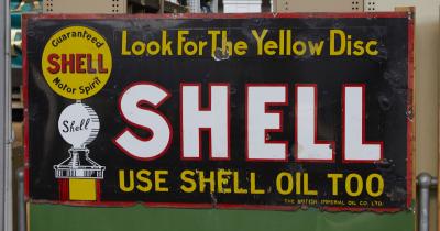 SHELL: A enamel Shell "Look for the Yellow Disc" original black Imperial Oil Company sign, 183x91cm.