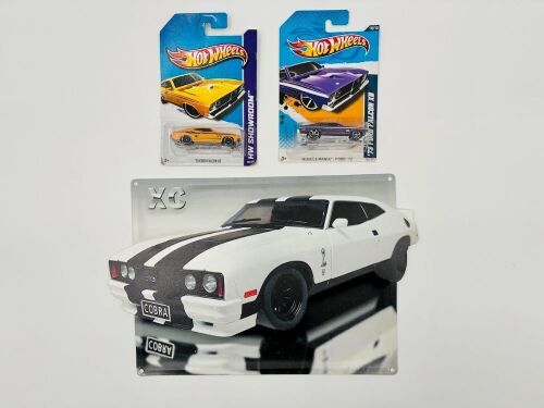 FORD FALCON: Two 1:64 scale Hot Wheels models of the Ford Falcon XB Hardtop together with an XC Cobra metal sign. [Location: Sydney]