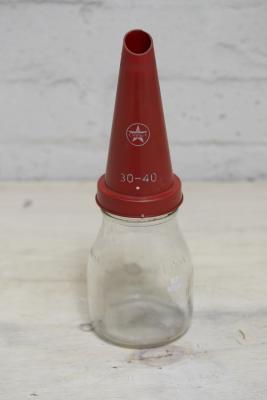 CALTEX: A glass one pint oil bottle with Caltex pourer, 28cm high.