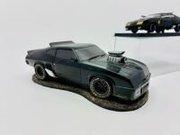 MAD MAX: Two models of the XB Falcon 'Interceptor' including a resin paperweight and a 1:43 scale model by Greenlight [Location: Sydney] - 2