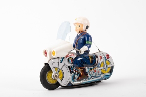 TIN TOY: A Japanese made tin toy, possibly circa 1960s or 1970s Police motorcycle, 23cm long