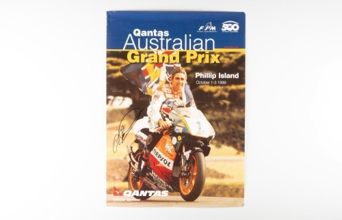 MICK DOOHAN: A signed poster promoting the 1999 Australian Grand Prix at Phillip Island, signed by Mick Doohan, 58cm high, 42cm wide