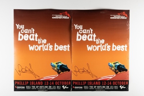 VALENTINO ROSSI: Two Valentino Rossi signed posters promoting the 2001 Australian MotoGP at Phillip Island, 58cm high, 42cm wide