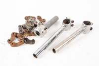 HANDLEBAR CLAMPS / TWISTGRIPS: A group of assorted handlebar clamps and some twistgrips