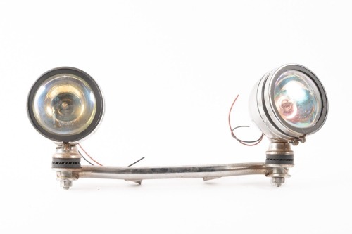 SPOTLIGHTS: Two Spotlights with Volga lenses fixed to bar to suit Indian or Harley, lens width 10cm, bar length 40cm